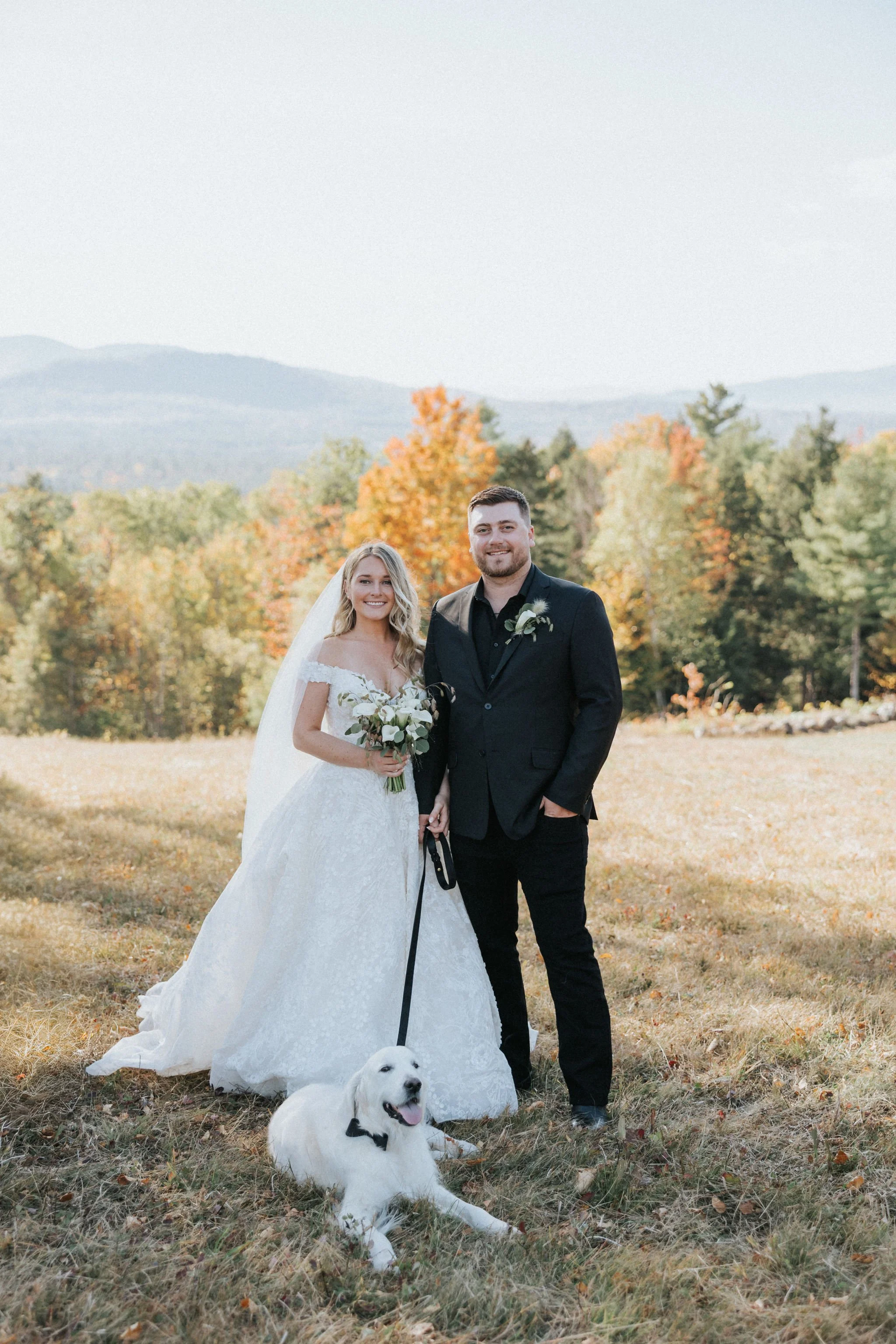 Maine newlywed couple pose with their white dog