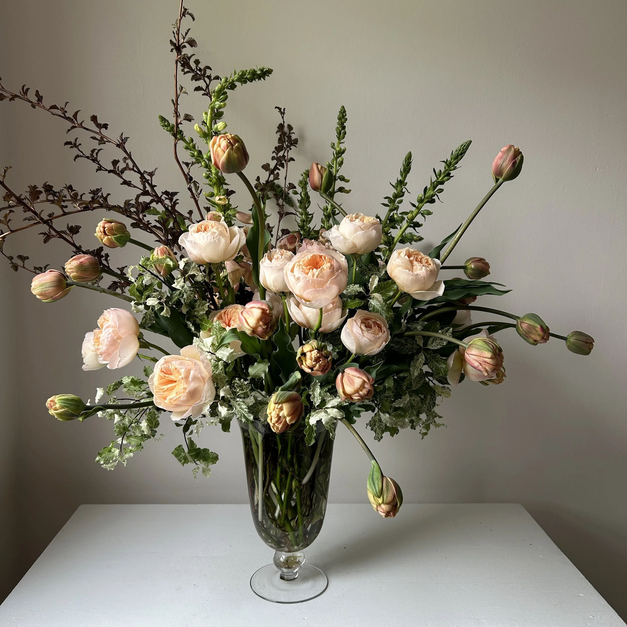 Stunning supreme tulip and garden rose arrangement by Harpswell, Maine florist.