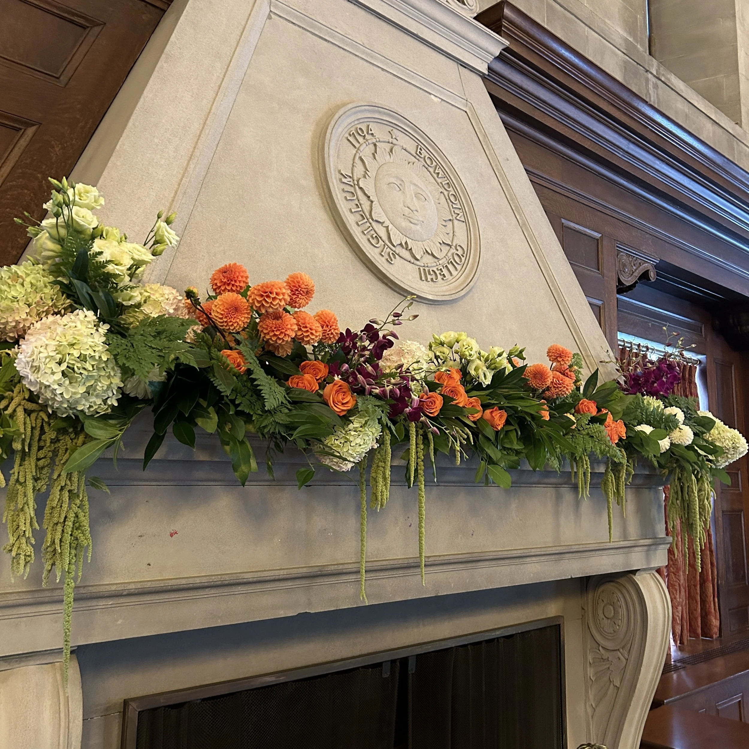 Lush Mantle Greenery with Orange Dahlias and Hanging Green Amaranthus