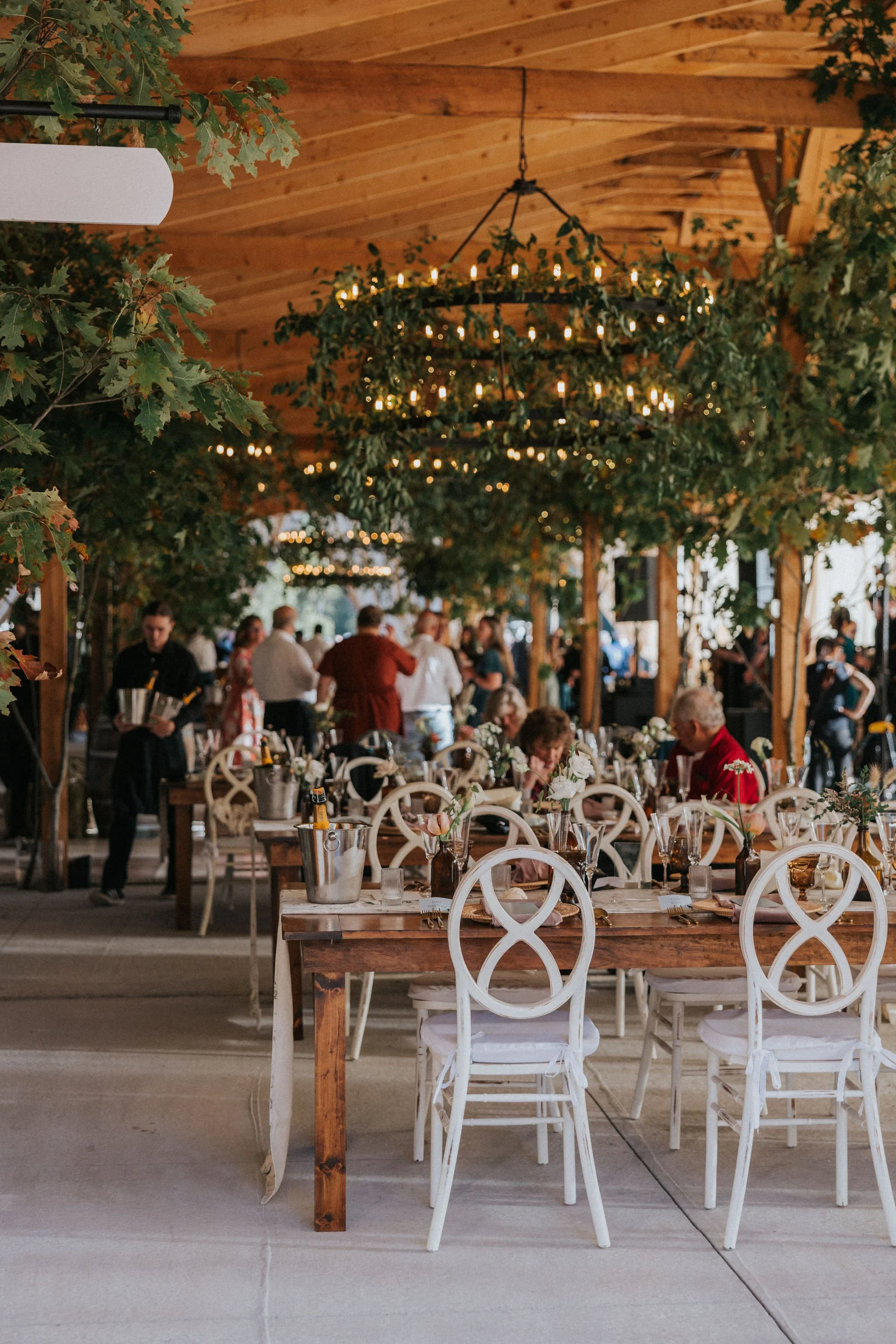 Brown bottle vase centerpieces by Maine florist Celadon Floral