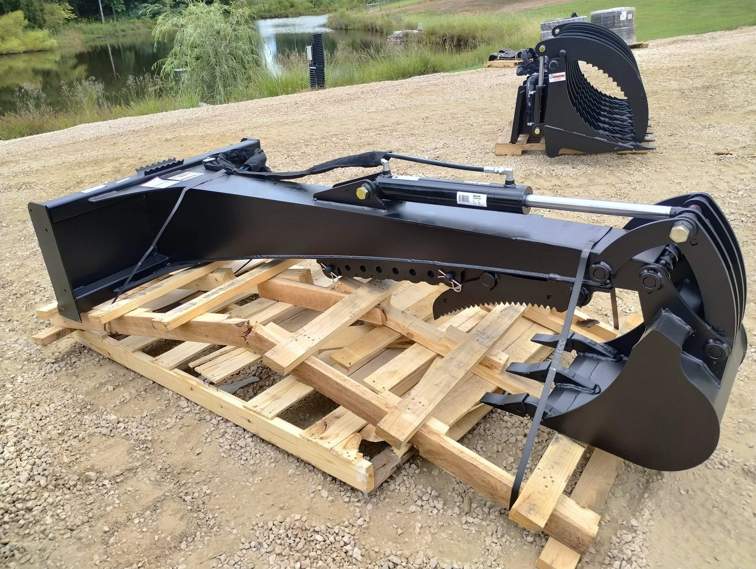 Jenkins Skid Steer Backhoe, long boom option with optional thumb and 18” bucket, for sale at Blue Best Equipment Sales, Richburg, SC.