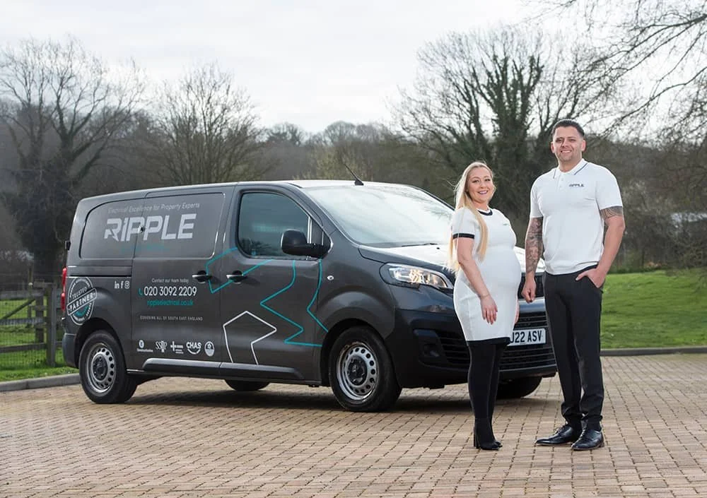 Two directors of Ripple Electrical company standing in front of branded van in Sevenoaks, Kent