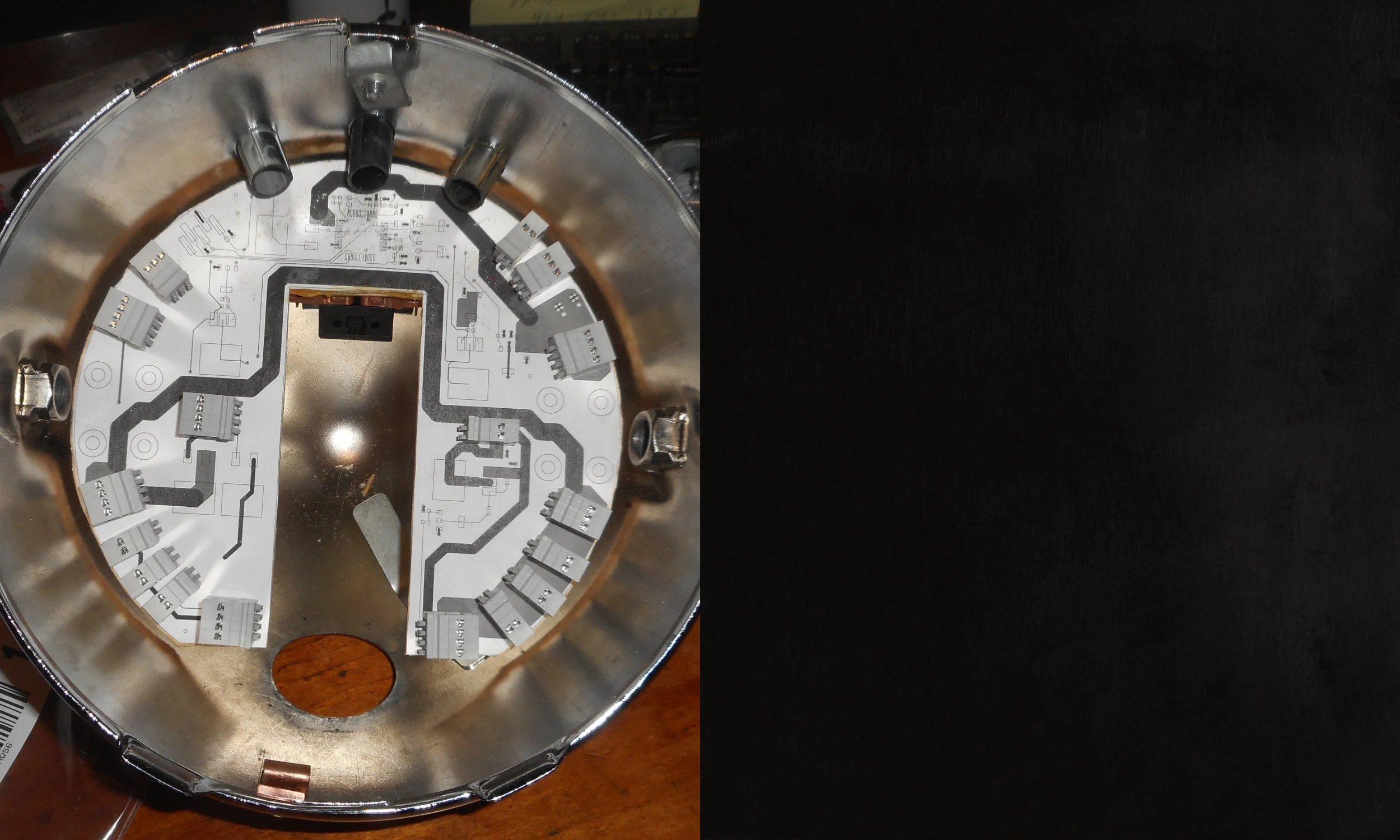 Once we had a complete PCB layout, before we went to fabrication with it, we printed a 1:1 paper copy, mounted it to balsa wood, and checked all clearances.