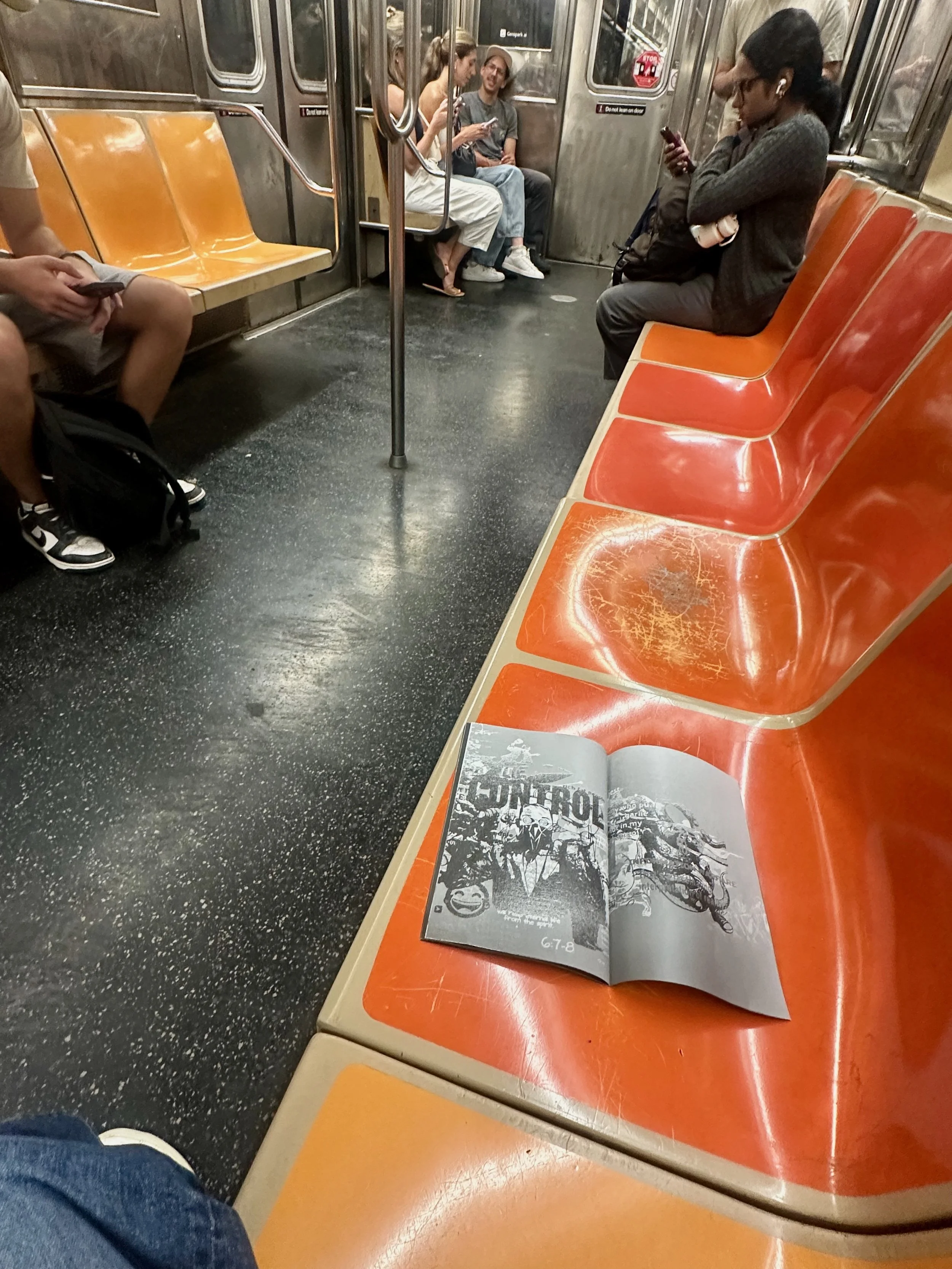 Cassandra Zampini’s MemeWarfare zine placed in a New York City public spaces as part of its distribution.