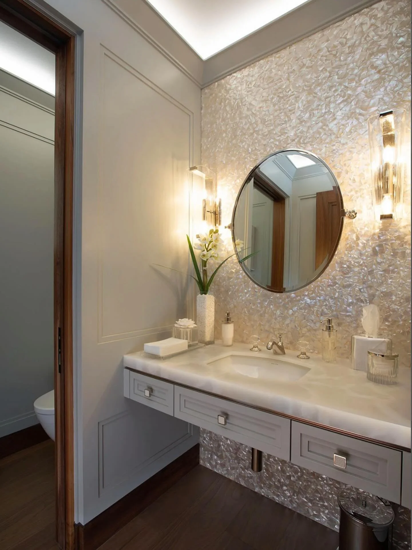 Mother of Pearl captivates in this guest bath. Simply Gorgeous!
