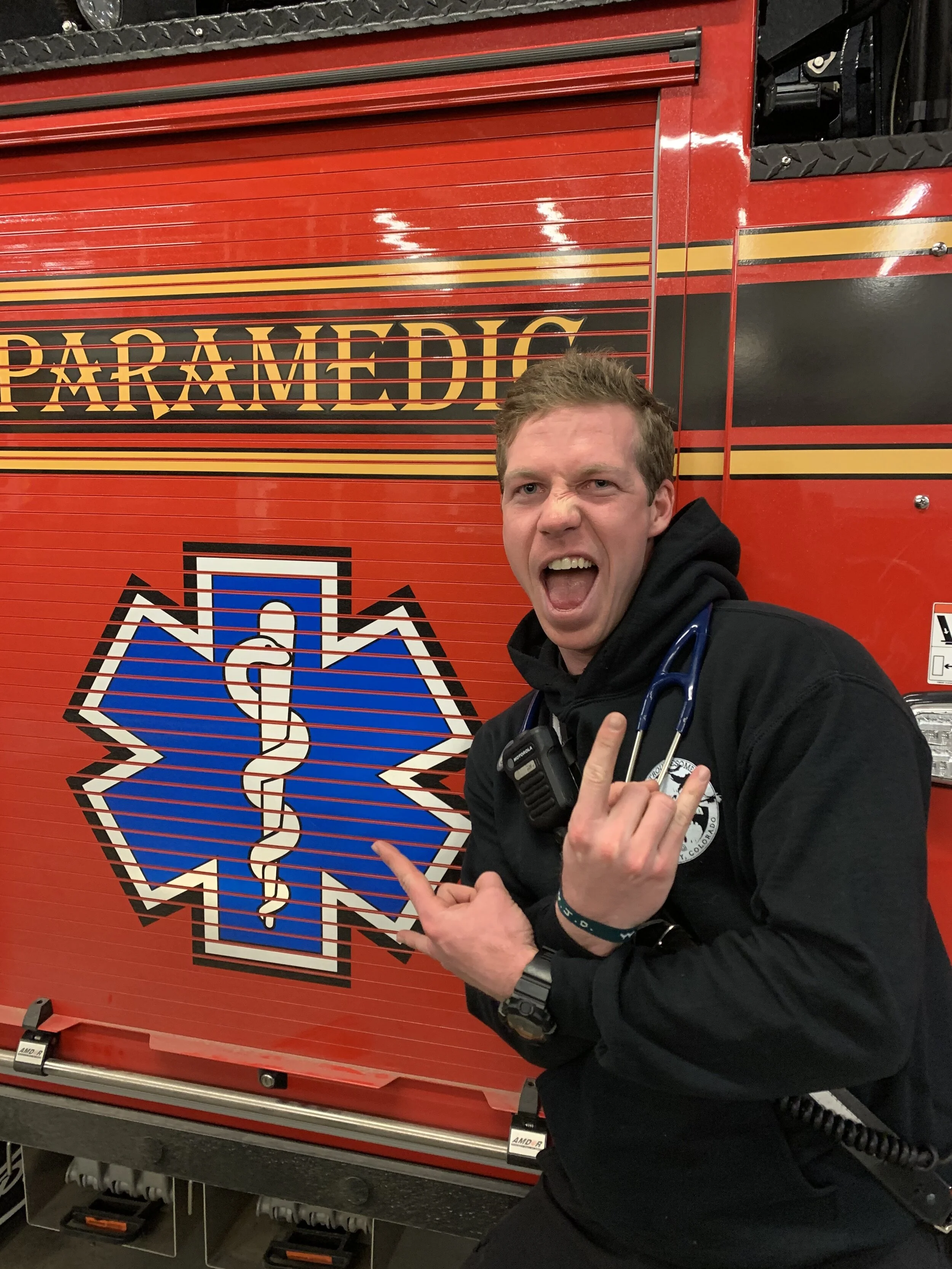 Ben Hochhalter posing by ambulance.