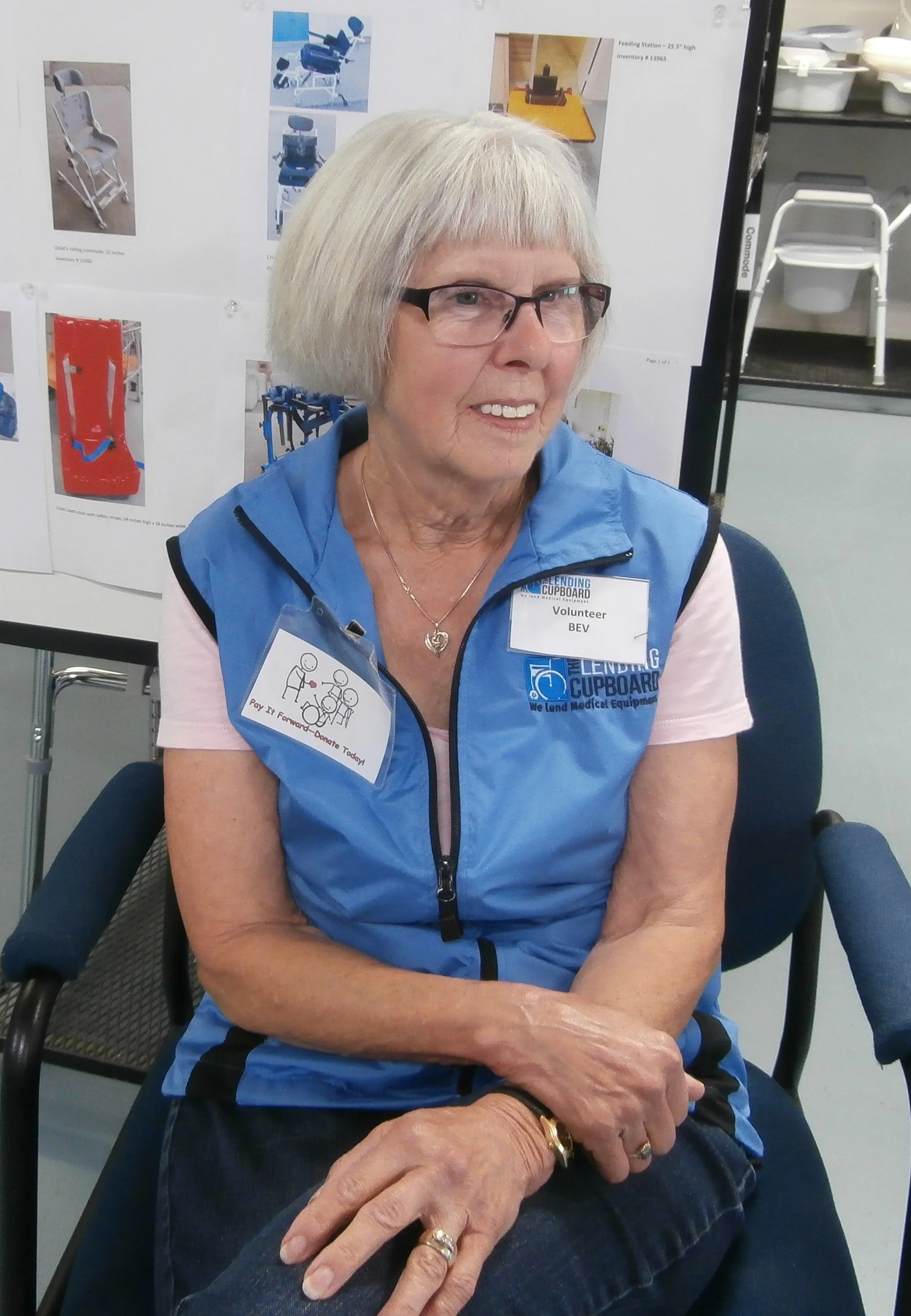 Bev smiling in the storefront of The Lending Cupboard® in Red Deer.