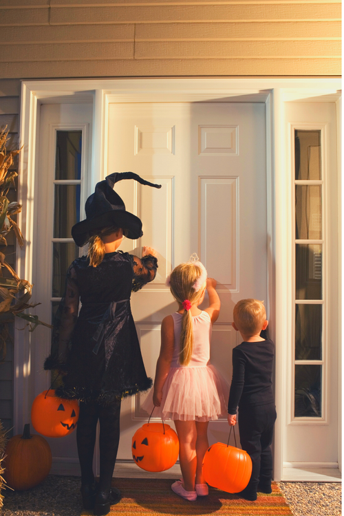 Kid trick or treaters knocking on a door