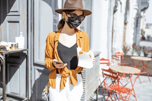 Masked woman ordering takeout