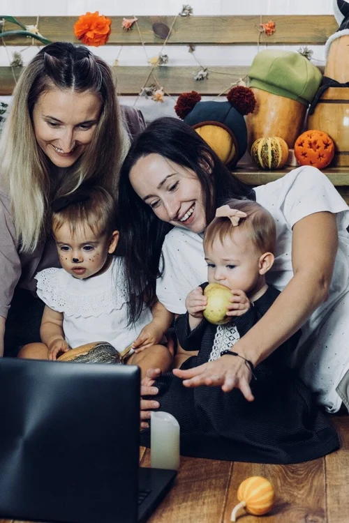 Two women enjoy a virtual hangout with family