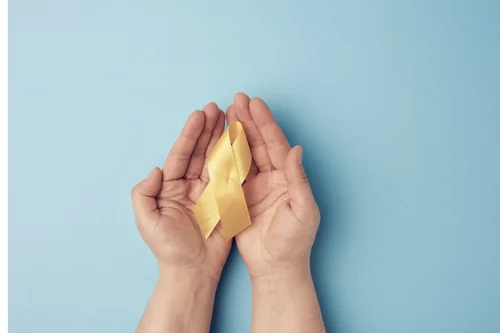 yellow ribbon in palms