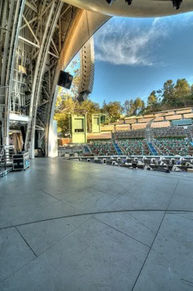 The empty Hollywood Bowl stage looking out at empty seats