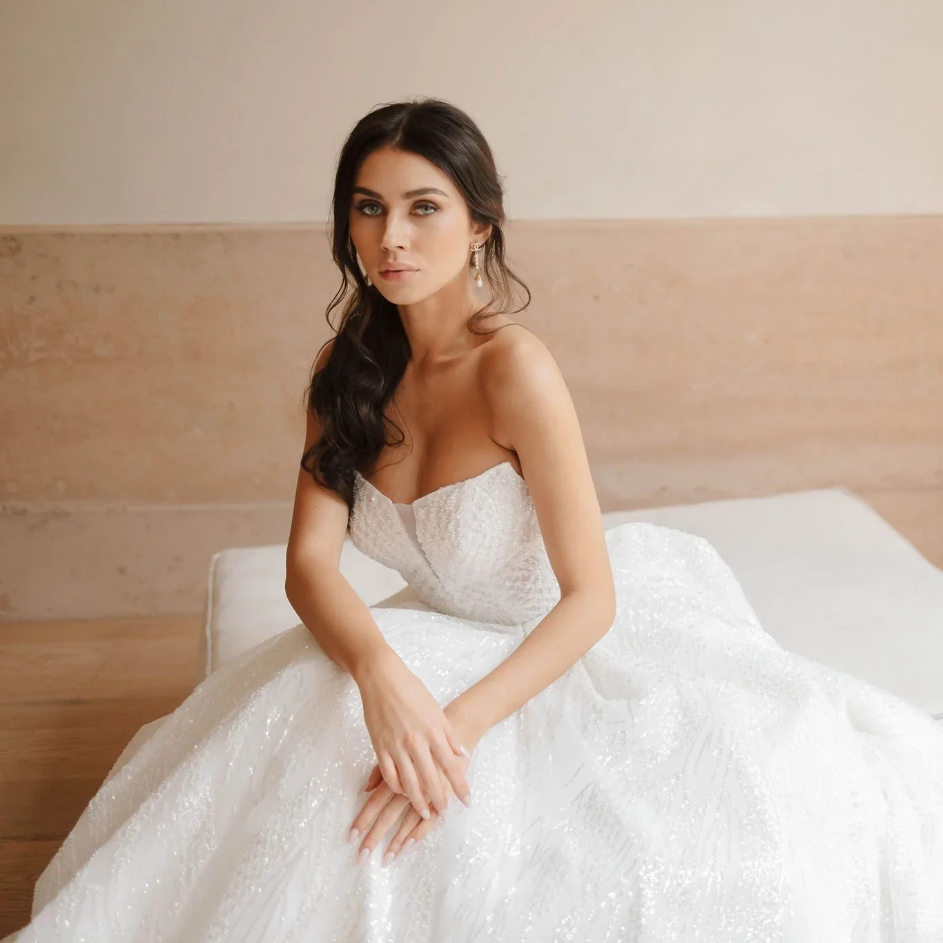 Opal strapless bridal gown with subtle sparkle in a minimal setting