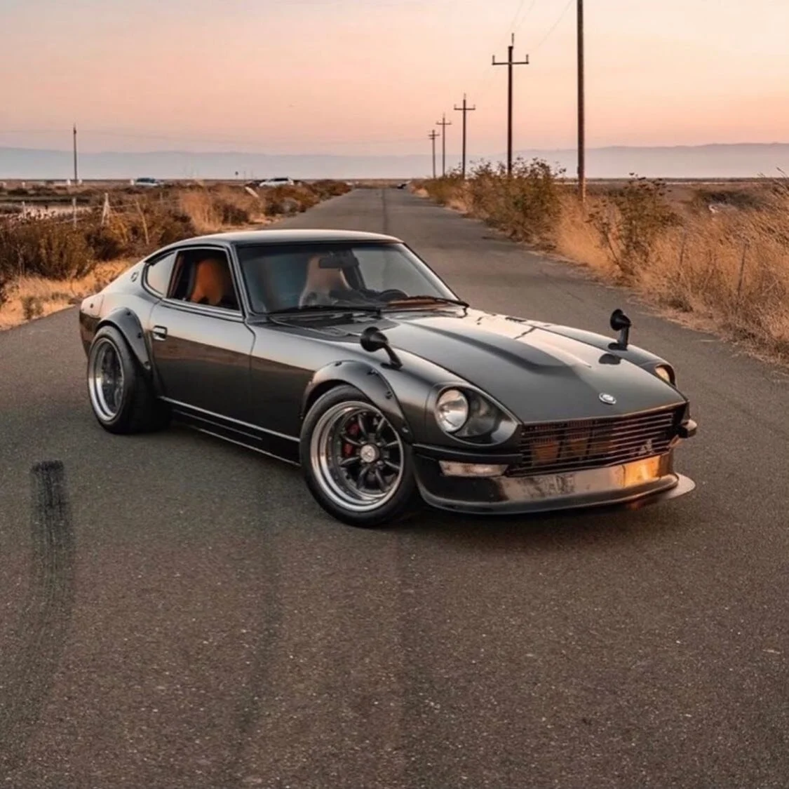 This Nassty 240Z is pushing 558 hp! Wow! 😊 ⁣
Admiring the paint? It&rsquo;s Ferrari&rsquo;s Grigio Silvertone color perfectly matches the extensive carbon fiber around the car... but did anyone else notice the Versace wheel cap?!?! This screams out 