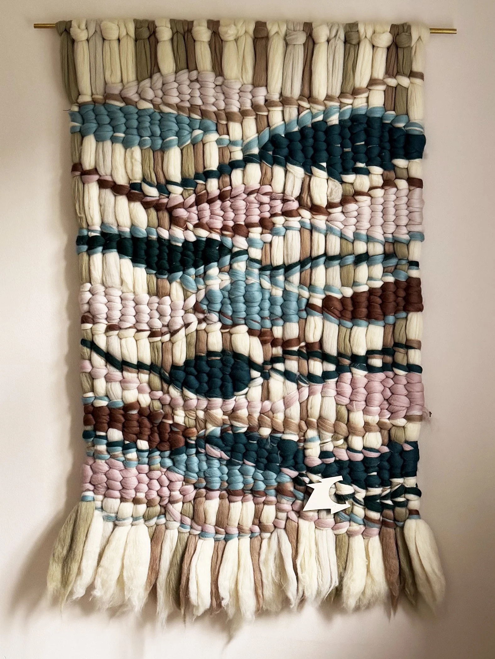 Woolwalls i smukke buede former i støvede teal, champagne, rosa, beige og råhvide farver.