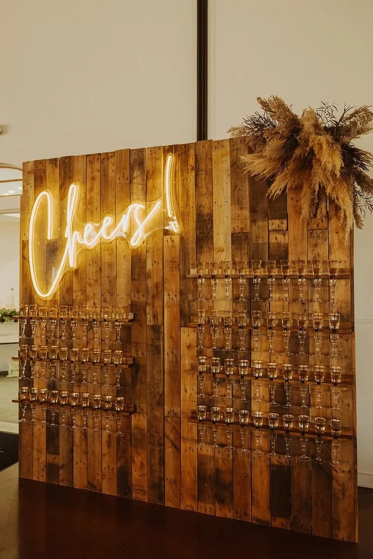 rustic wooden champagne wall with neon sign