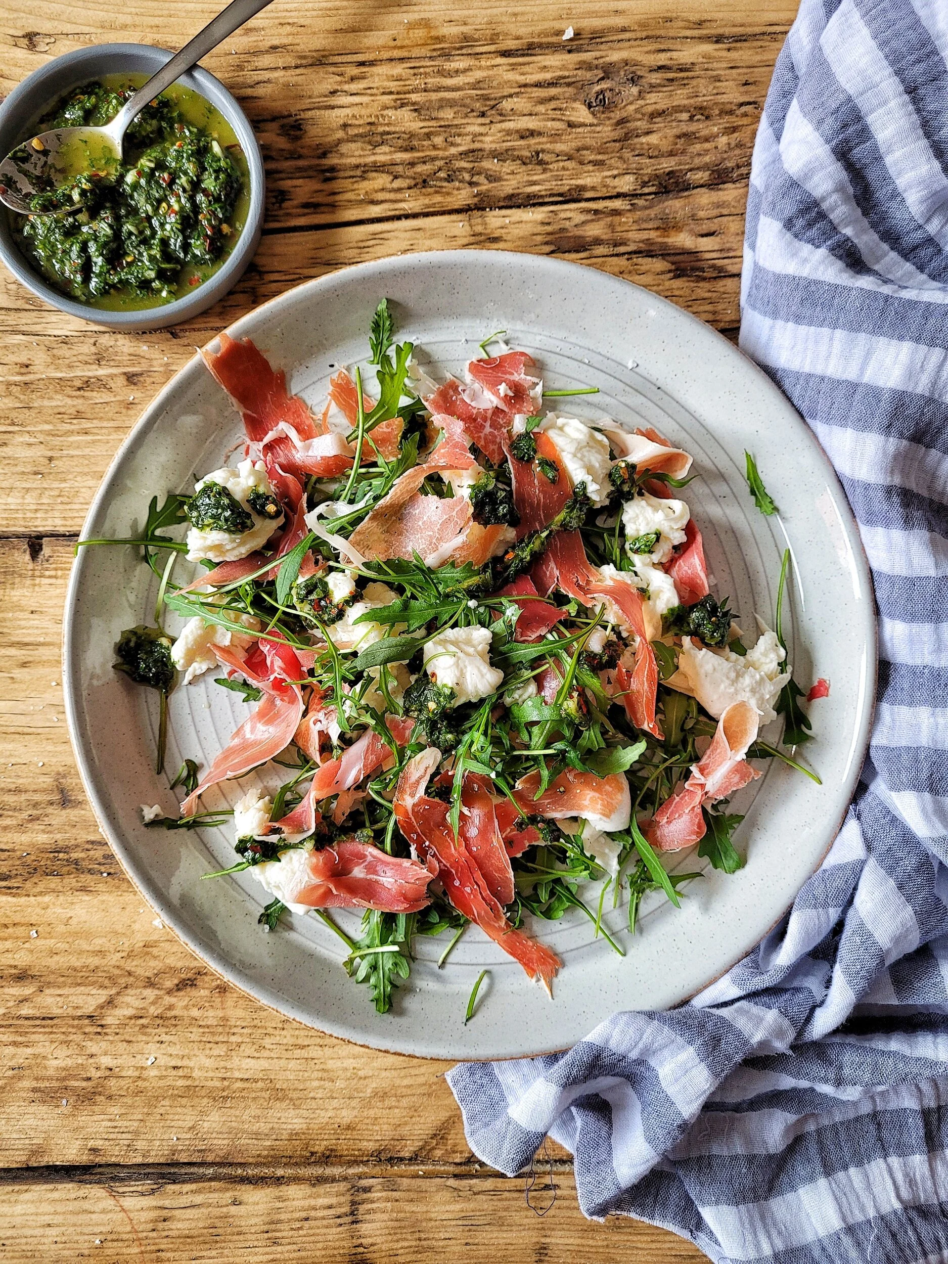 Prosciutto, mozzarella  and rocket salad with basil oil
