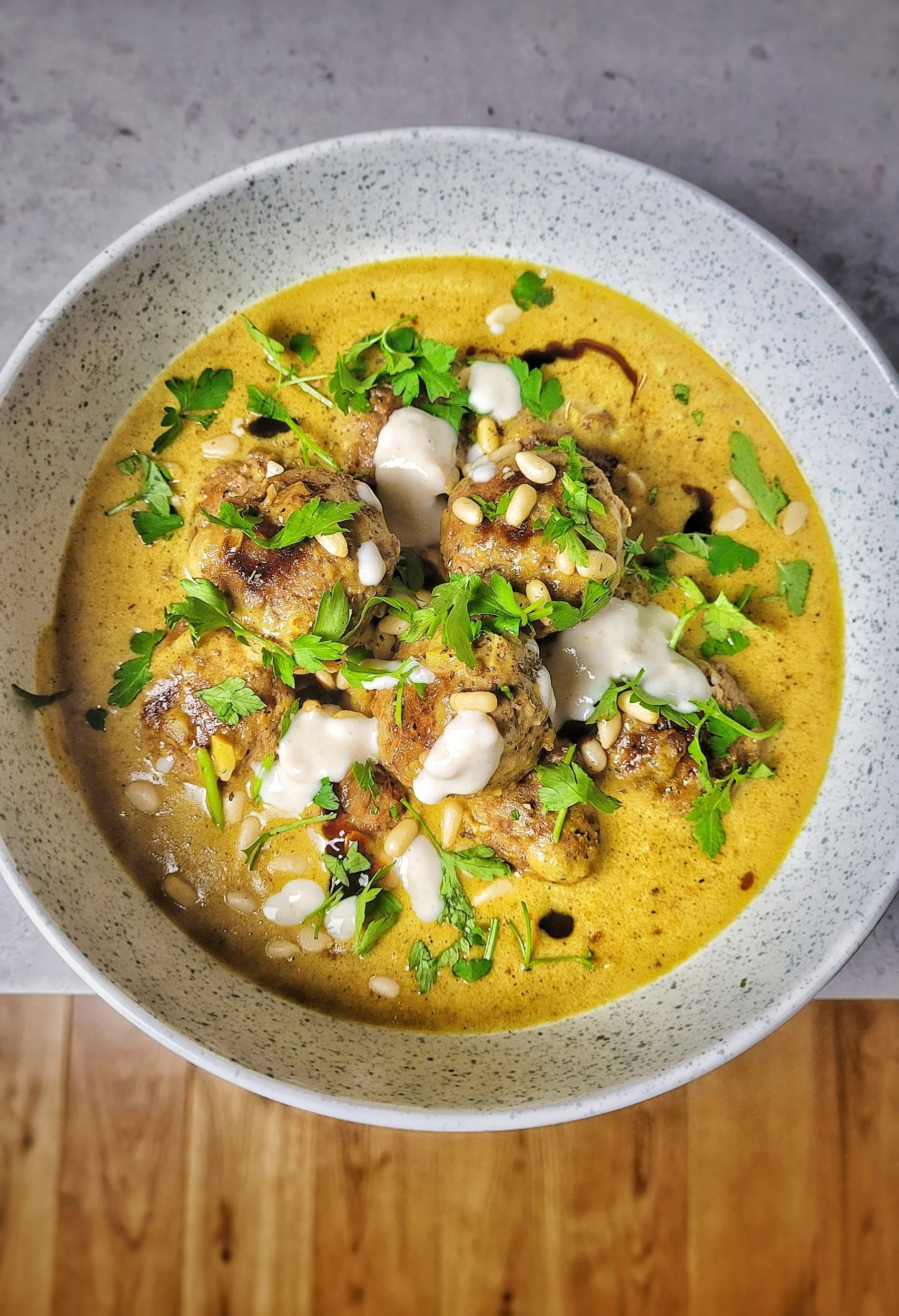 Middle eastern beef meatballs in a white bean spiced houmous sauce