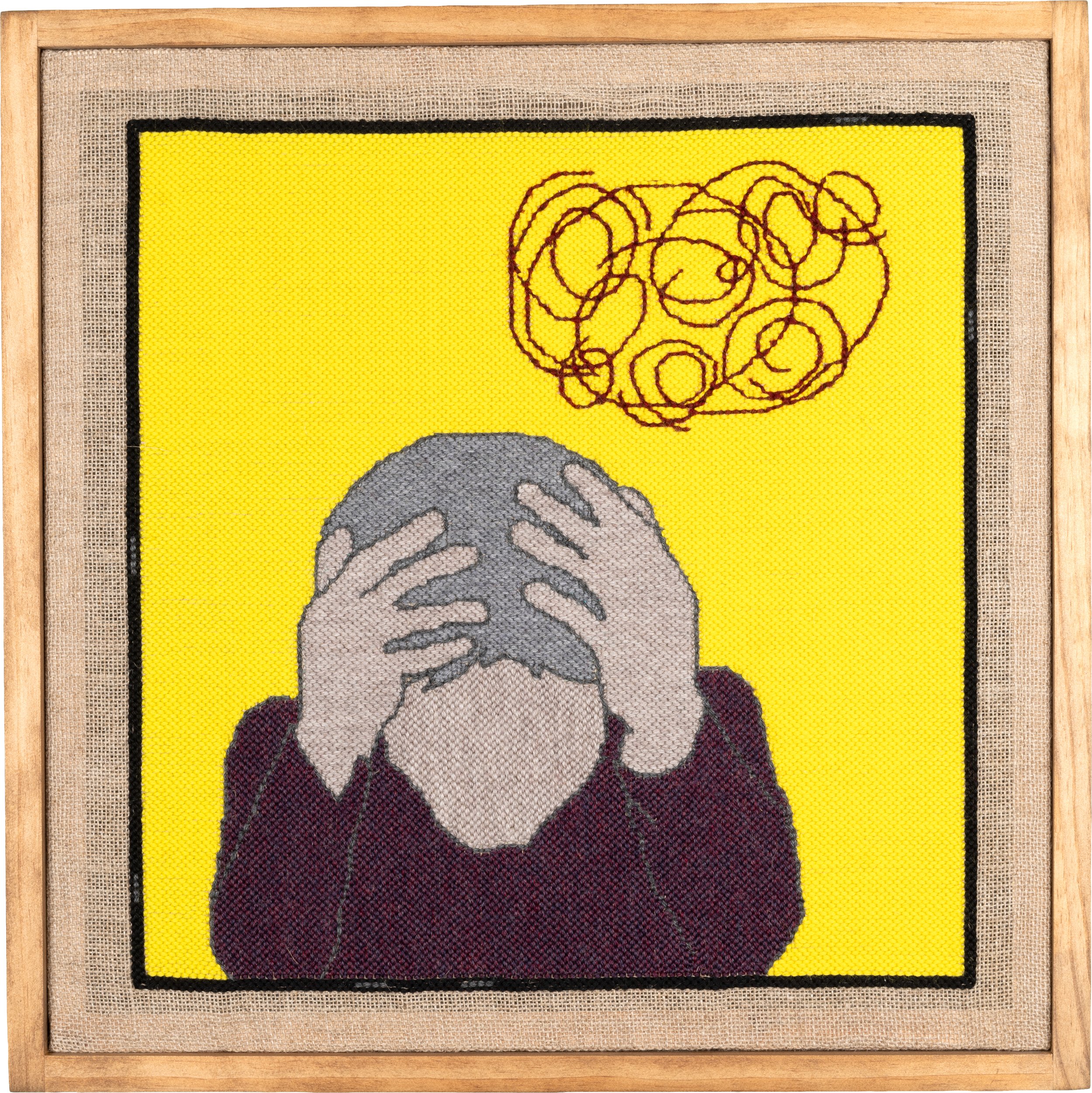 punch needle fiber art of a figure with head in hands, a squiggly cloud depicting thoughts or worries above them
