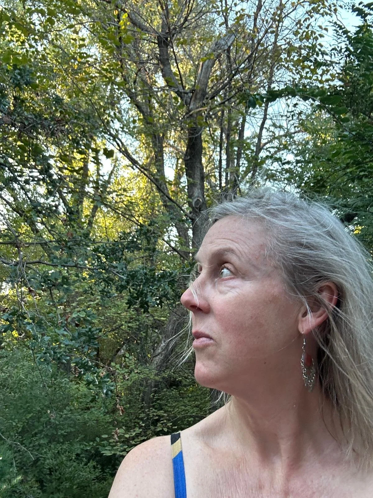Here I am outside in Oklahoma talking to the trees, a source of inspiration for my creativity.