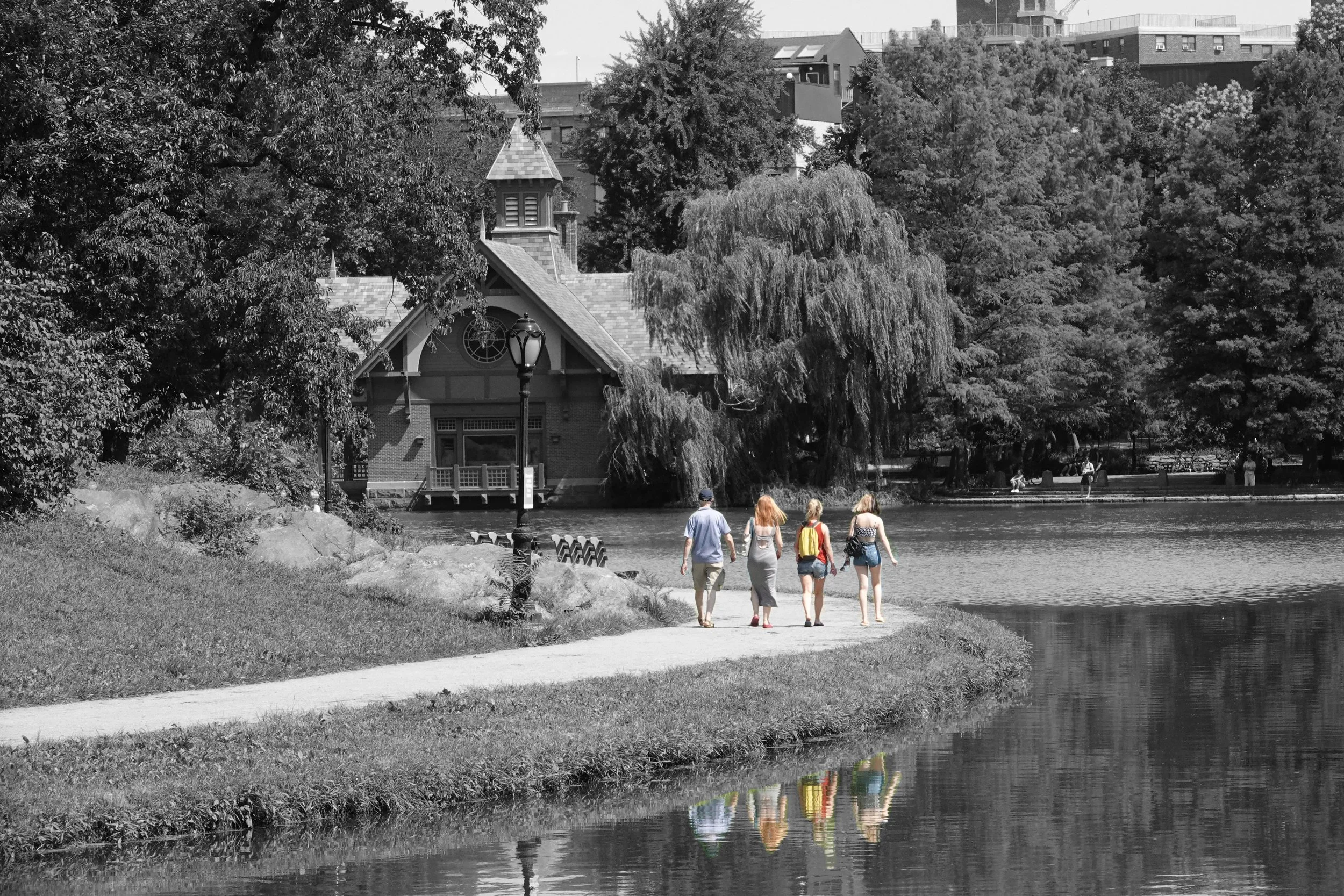  Now we’re at the Harlem Meer in the northeast corner of Central Park where some visitors (along with their reflections) are taking a stroll. 