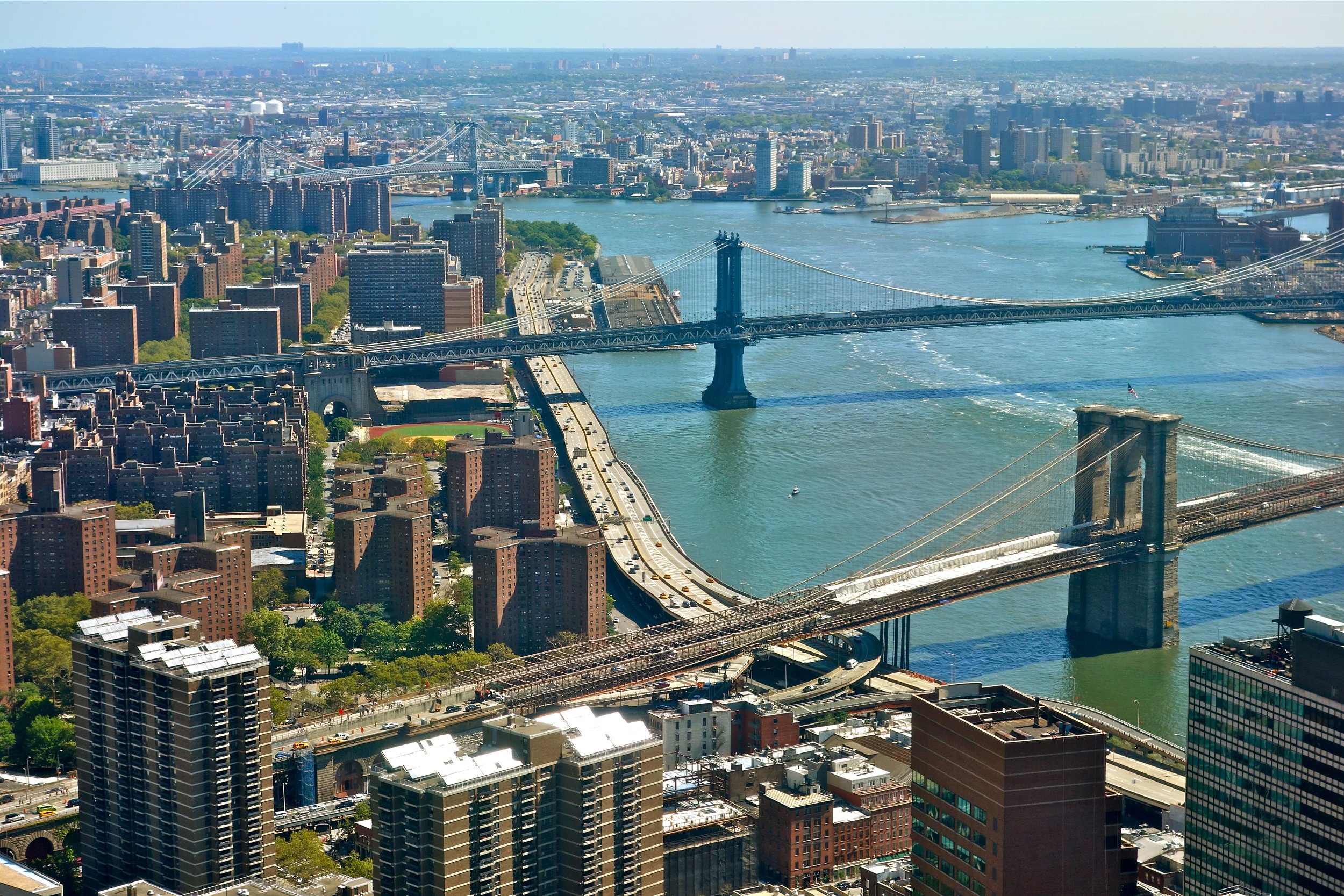 I found a good perch high in a downtown office building to take a long-range view of three East River bridges (2016).