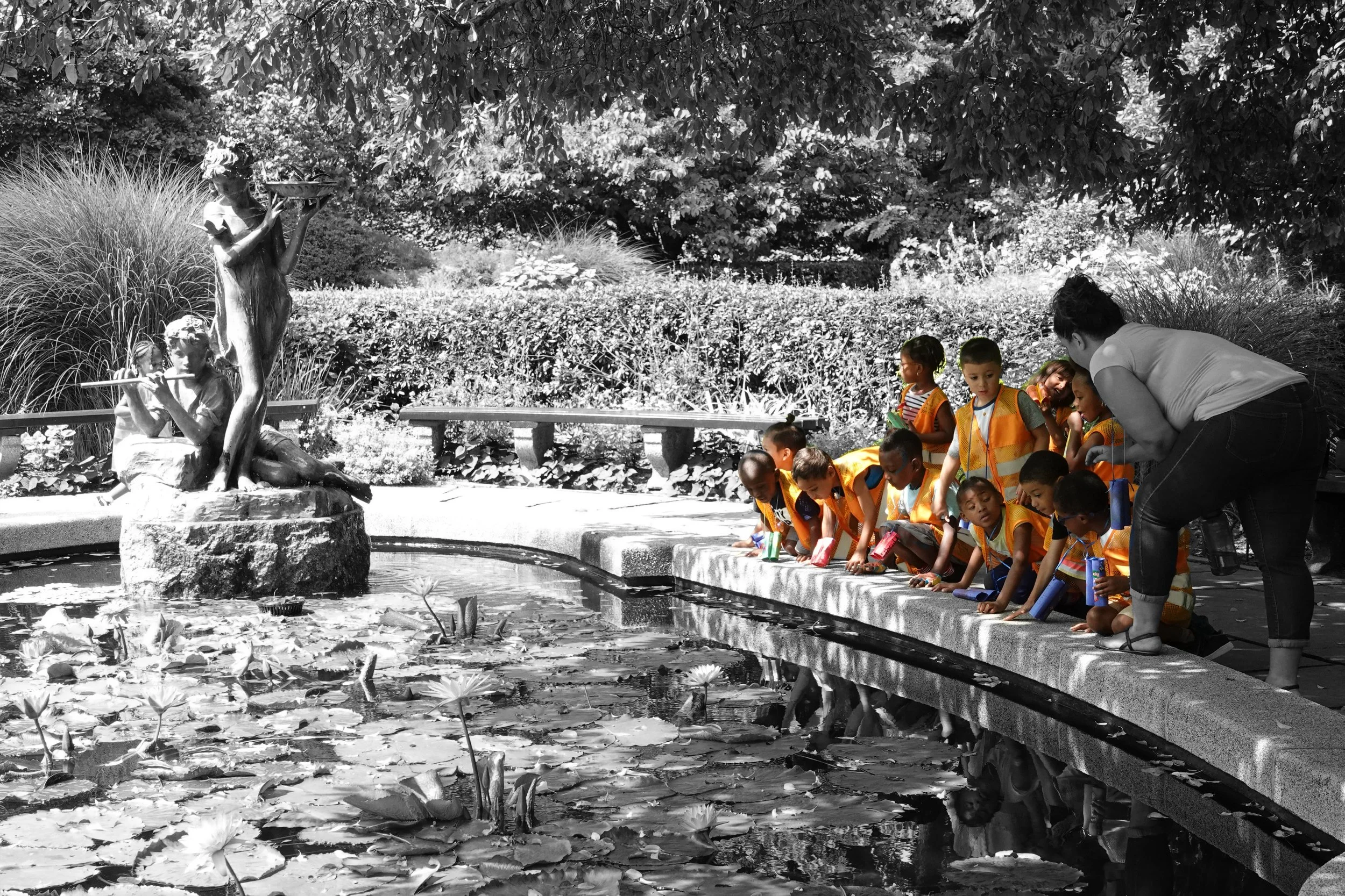  These colorful kids are taking in a waterside view of this lovely maiden in Central Park’s Conservatory Garden. 