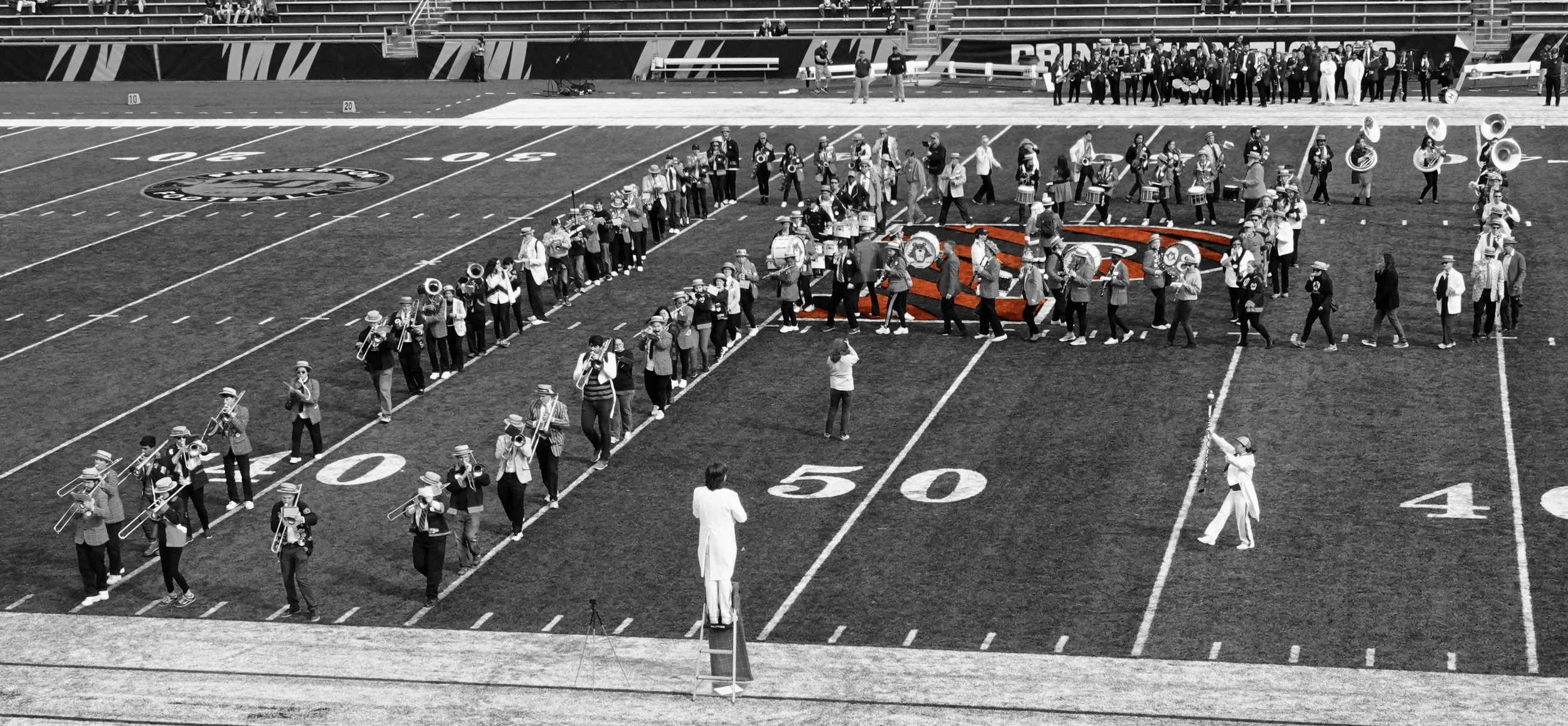 Now we’re at a Princeton University football game, with the black and white band members marching over a colorful giant “P" (so you can tell it was a home game). 