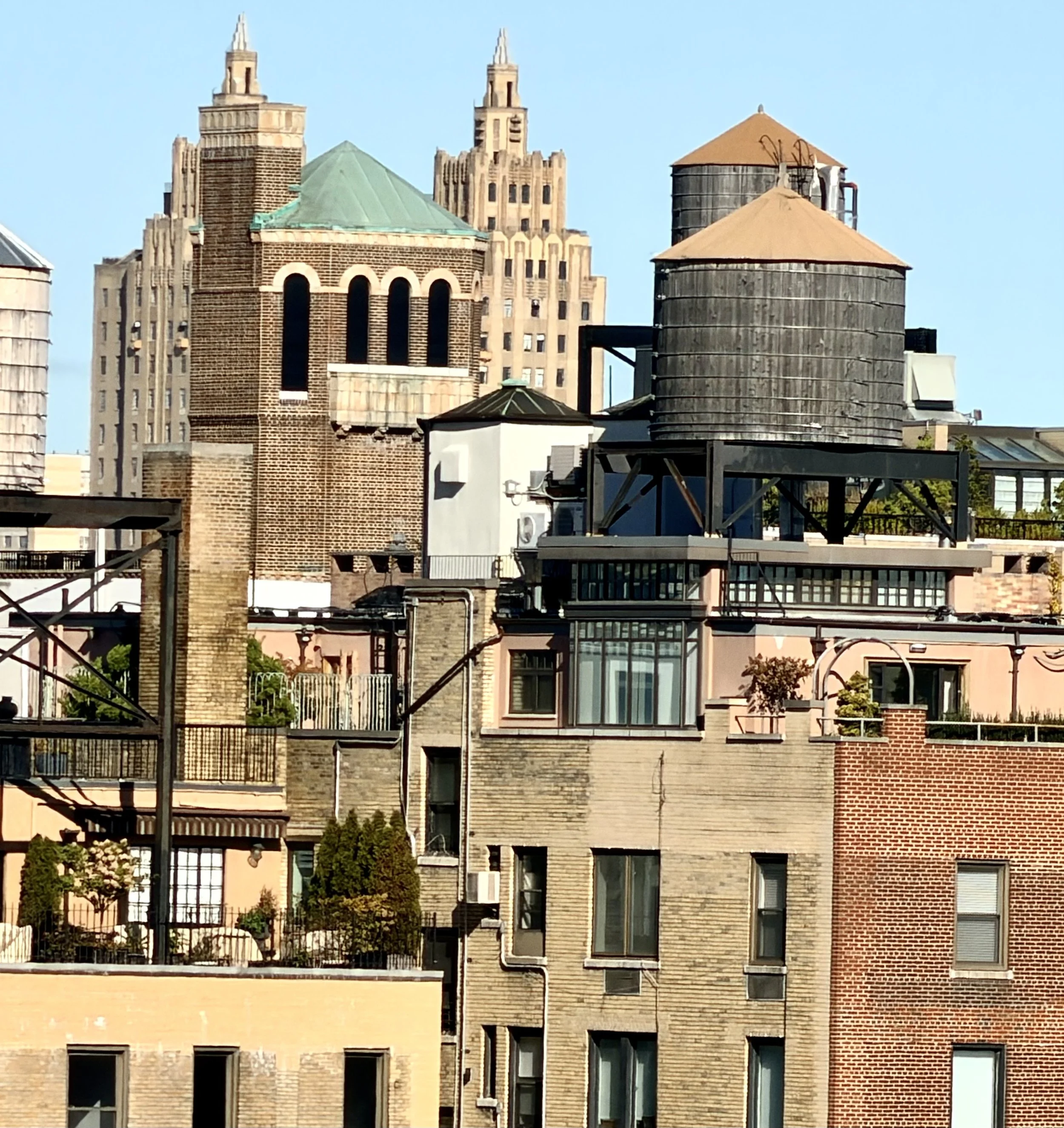  I completed the triad with this shot of a nearby water tower but  nestled among some interesting buildings. I really appreciated  the camera’s versatility. 
