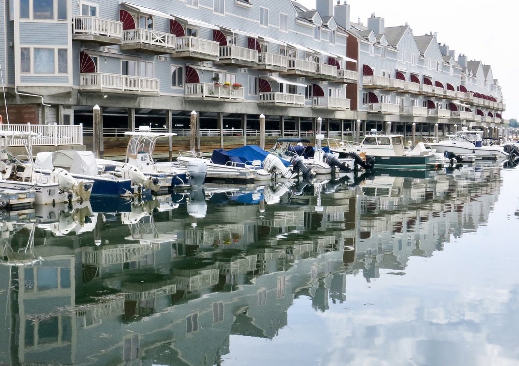 I’ve long been partial to photos of boats and buildings reflected in water, as in this shot of Chandler’s Wharf in Portland, Maine (2018).