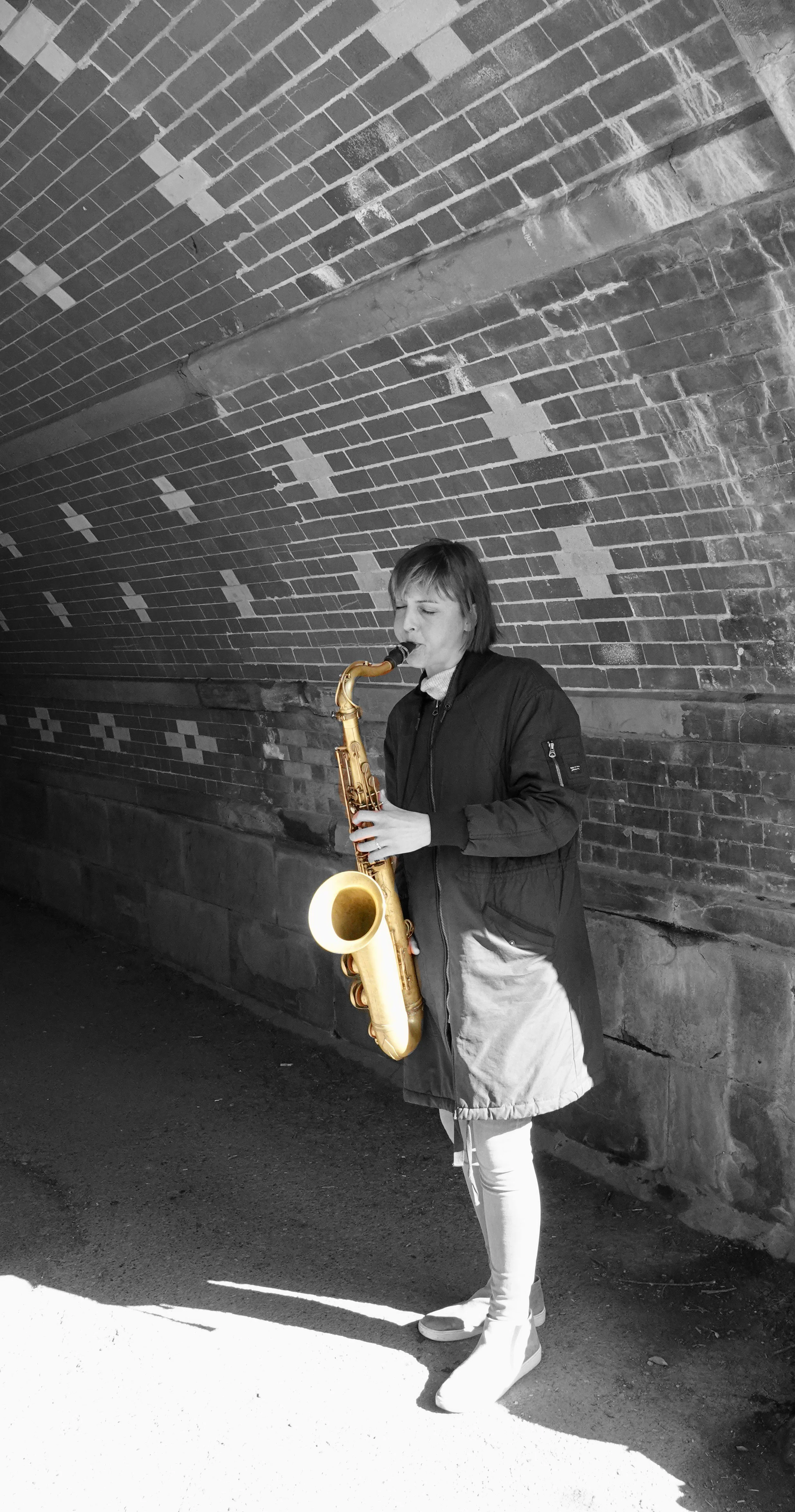  Still in Central Park, we’re listening to tuneful notes flowing from  a golden sax. 