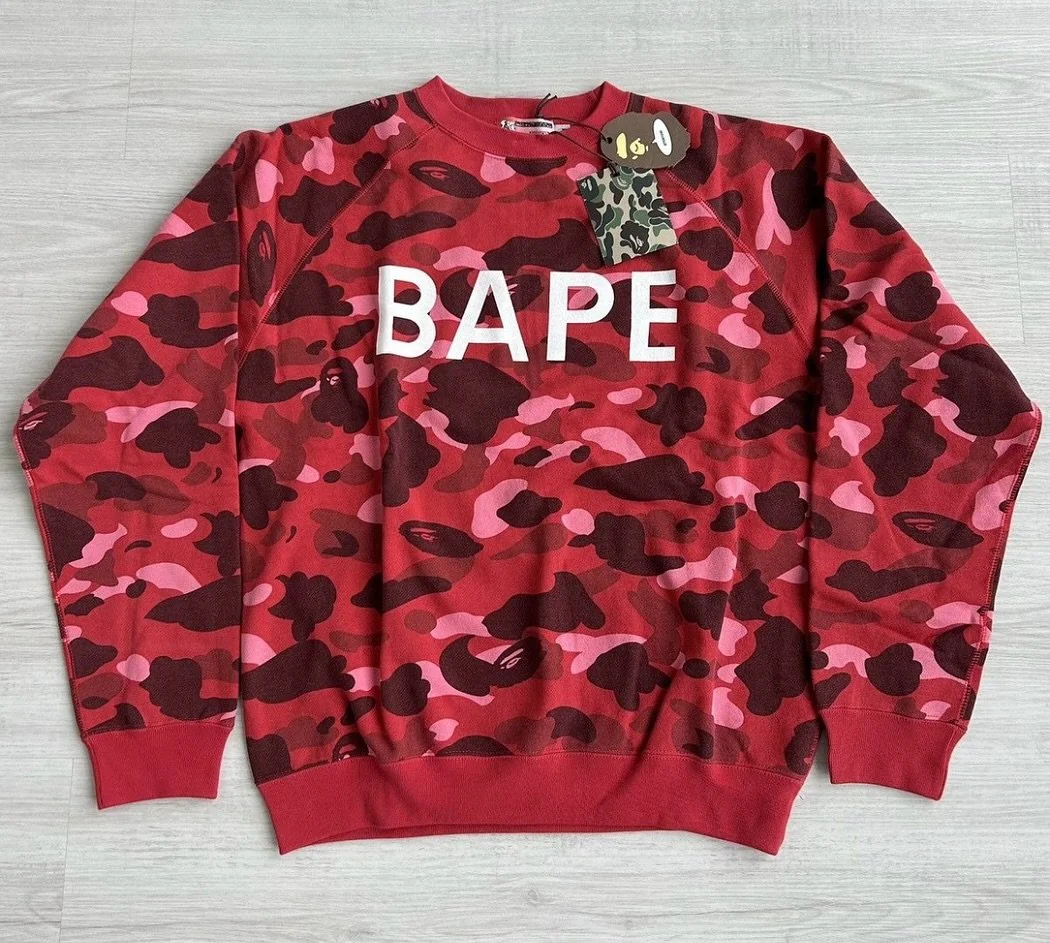 The &ldquo;N.E.R.D. Camo&rdquo; is a specific camouflage pattern tied to the early 2000&rsquo;s collaboration between A Bathing Ape and N.E.R.D., the band fronted by Pharrell Williams &amp; Chad Hugo. 

It&rsquo;s most recognizable in a red camo colo