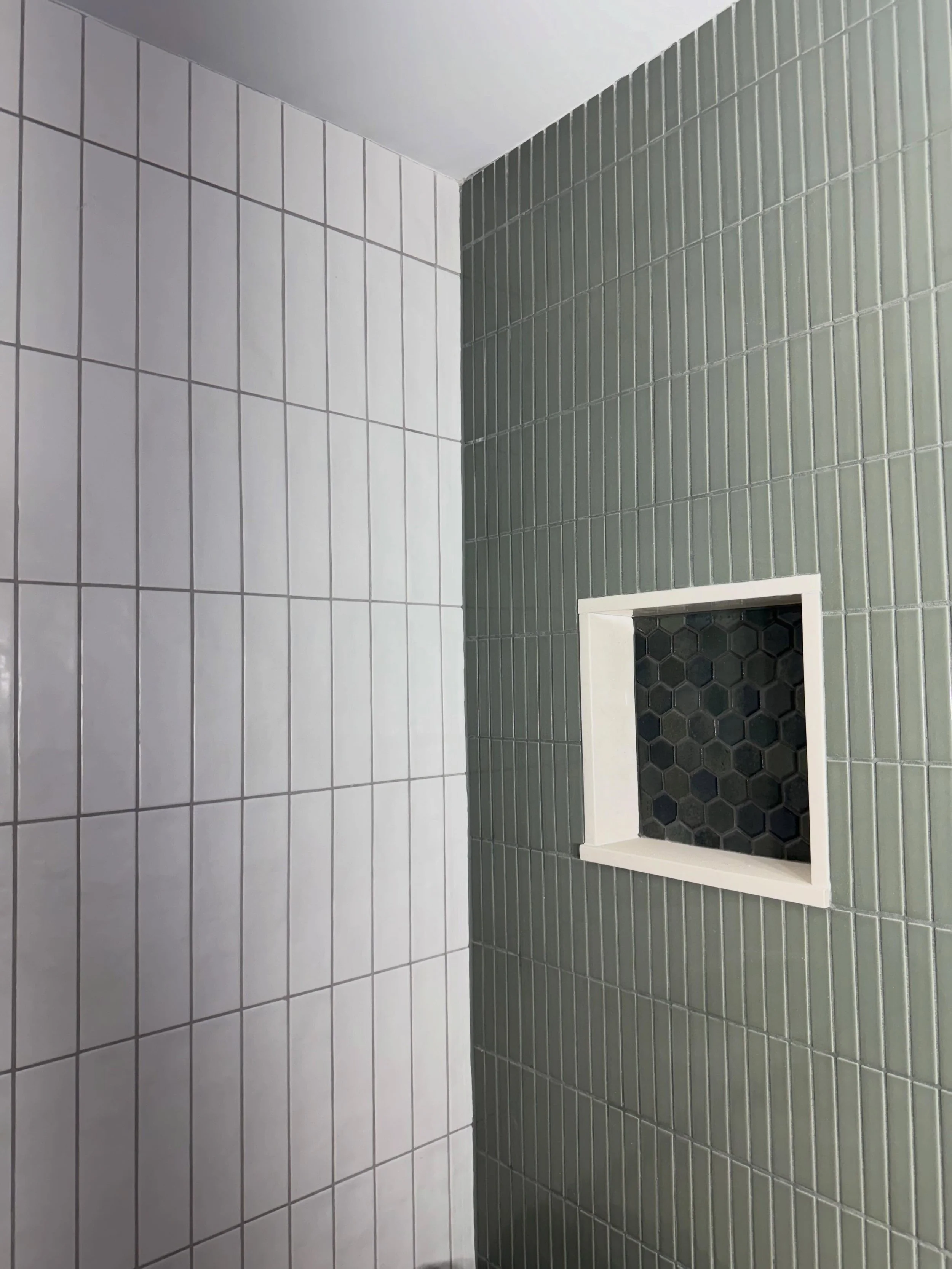 This is just one bathroom in a full home remodel we&rsquo;ve been working on, and the details are coming together beautifully. 
From the clean vertical layout to the bold accent niche, this space is already making a statement. More to come soon!

#cc