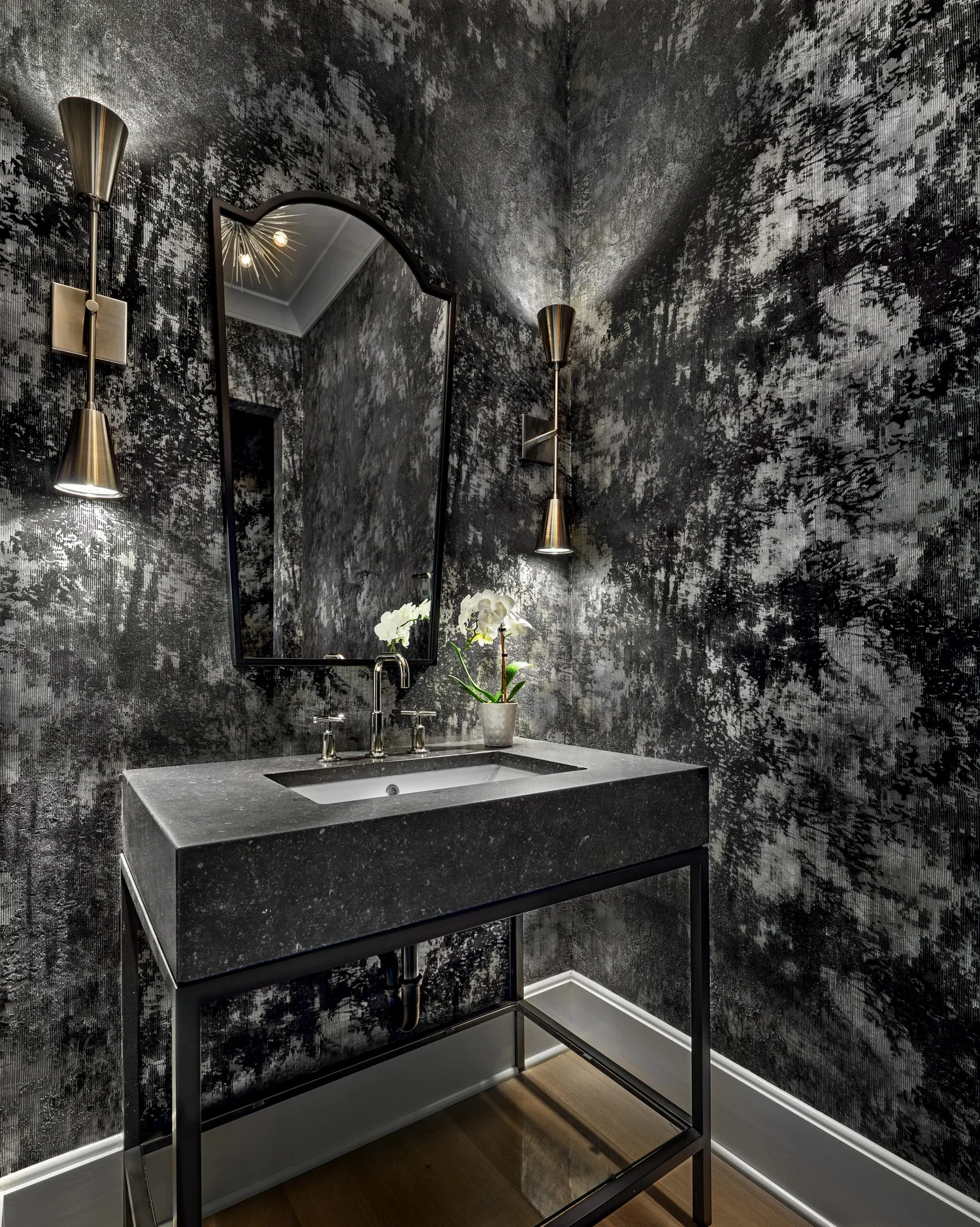 Bathroom with tiled surround and considered fixtures