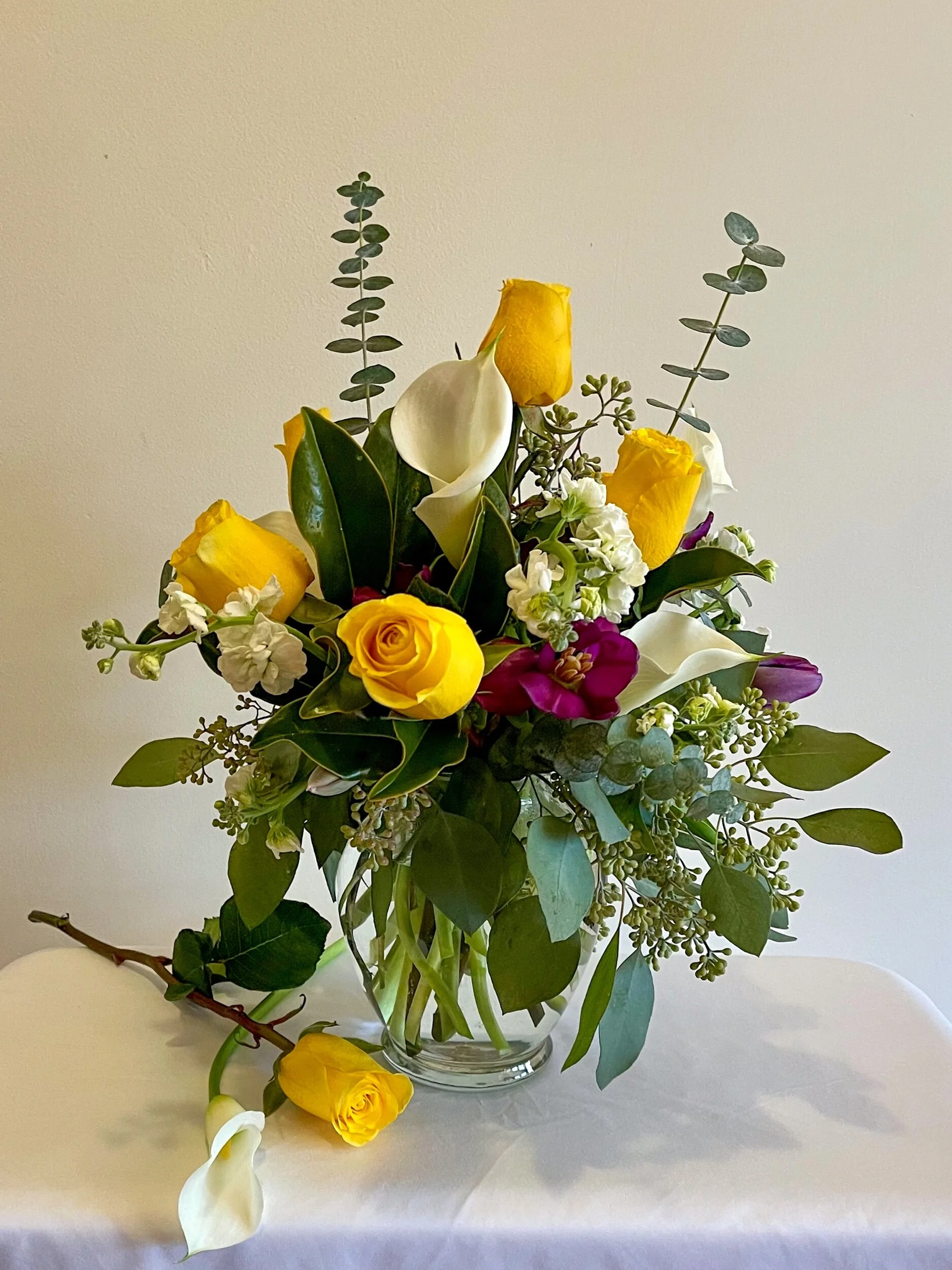 Assorted flowers in a clear vase