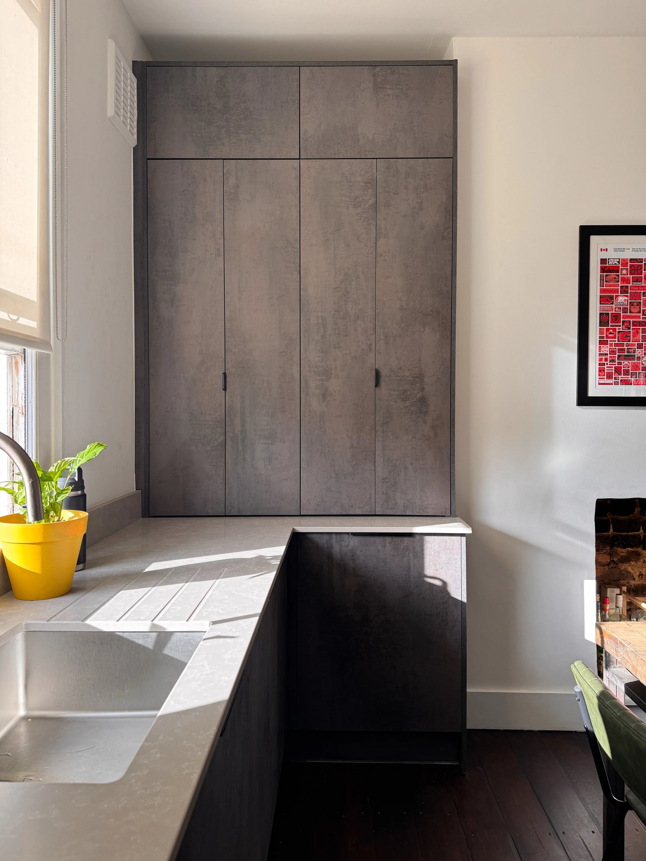 The brief for this kitchen was pretty simple: add storage, counter space, and make it look better! Here's how we squeezed as much storage out of this kitchen as possible.

1. Stacked the wall cupboards almost to the ceiling, with less frequently used