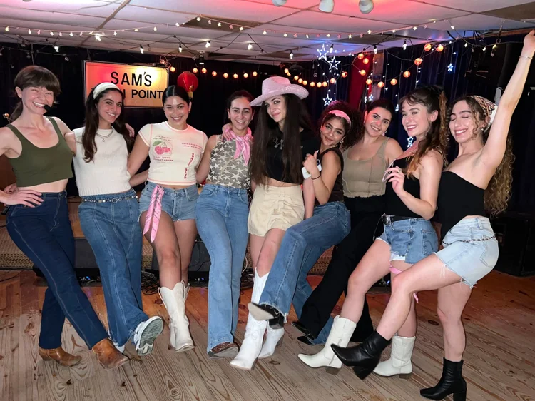 A bachelorette group having a blast at a Double or Nothing line dance lesson in Austin