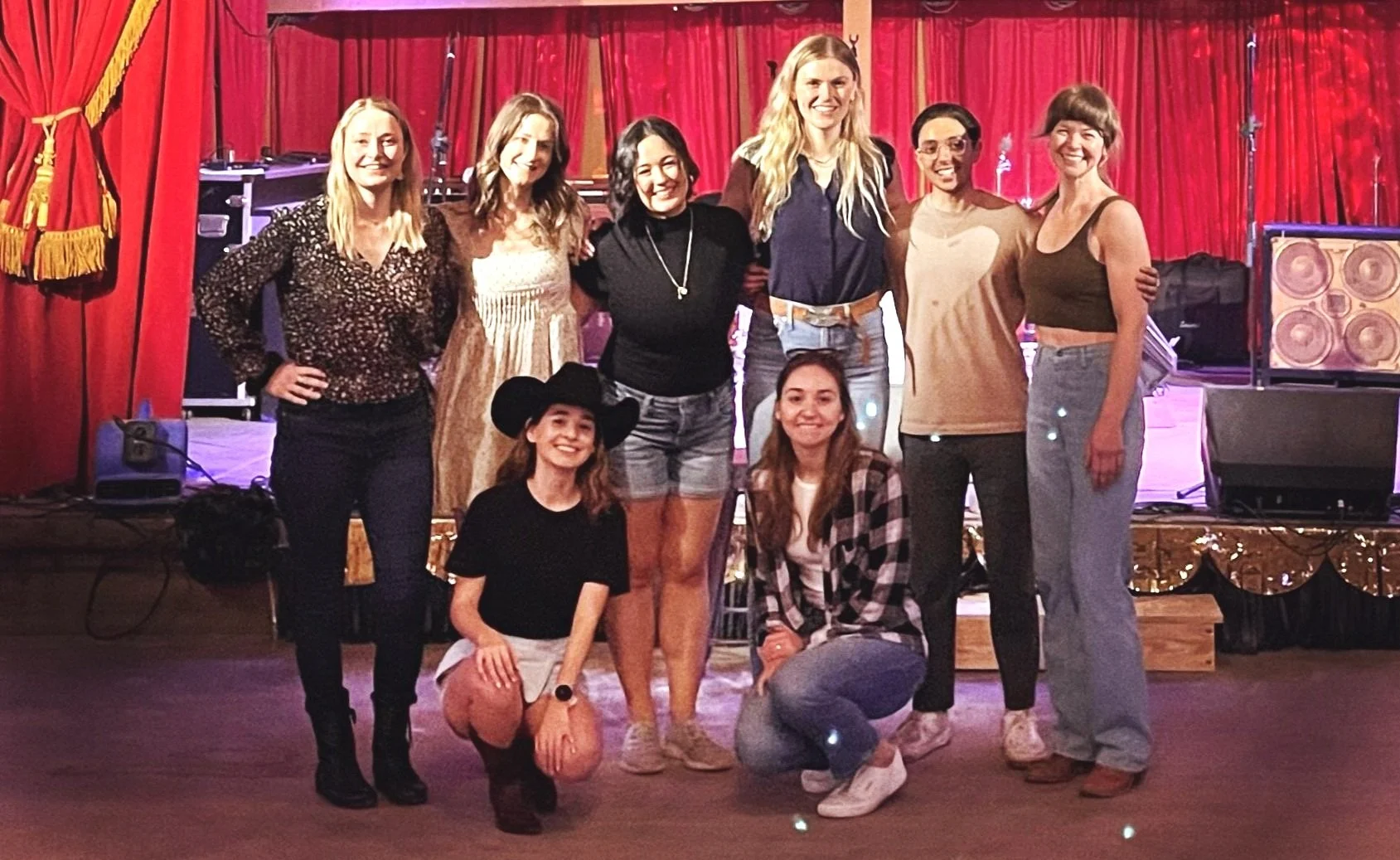 Bride and bridesmaids posing after learning line dancing in Austin