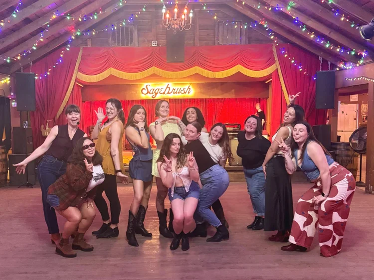 A big bachelorette group at a Double or Nothing line dance lesson in Austin