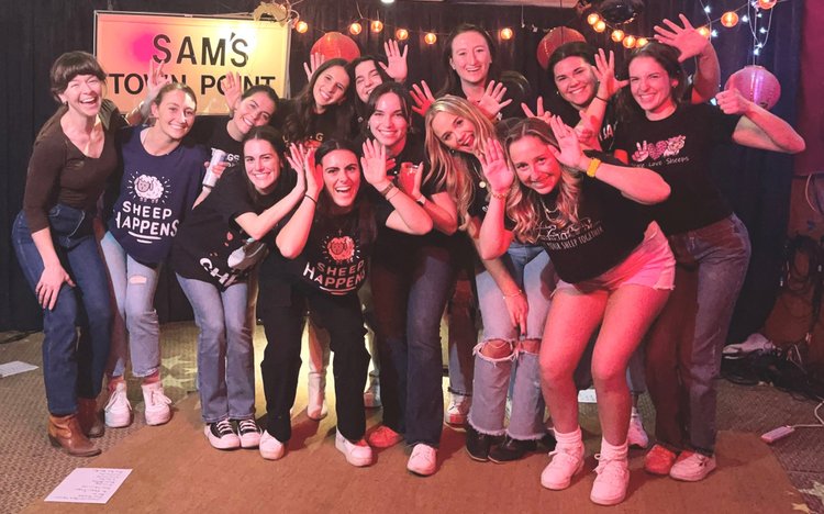A bachelorette crew celebrating a line dance lesson at an Austin honky-tonk
