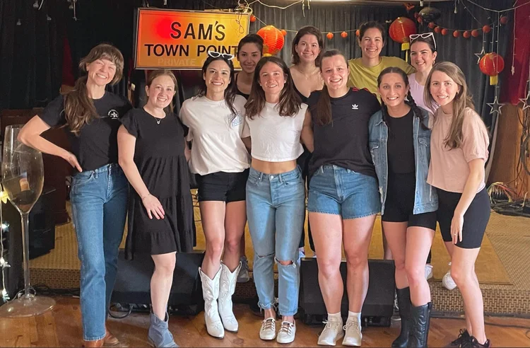A bachelorette group at an Austin honky-tonk line dance lesson