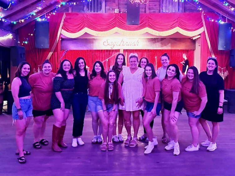 A bachelorette party posing after a line dance lesson in Austin