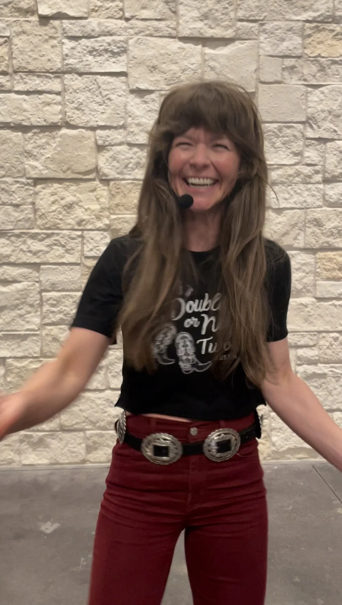 Vanessa Vaught teaching a two-step lesson to a room of dancers at an Austin honky-tonk