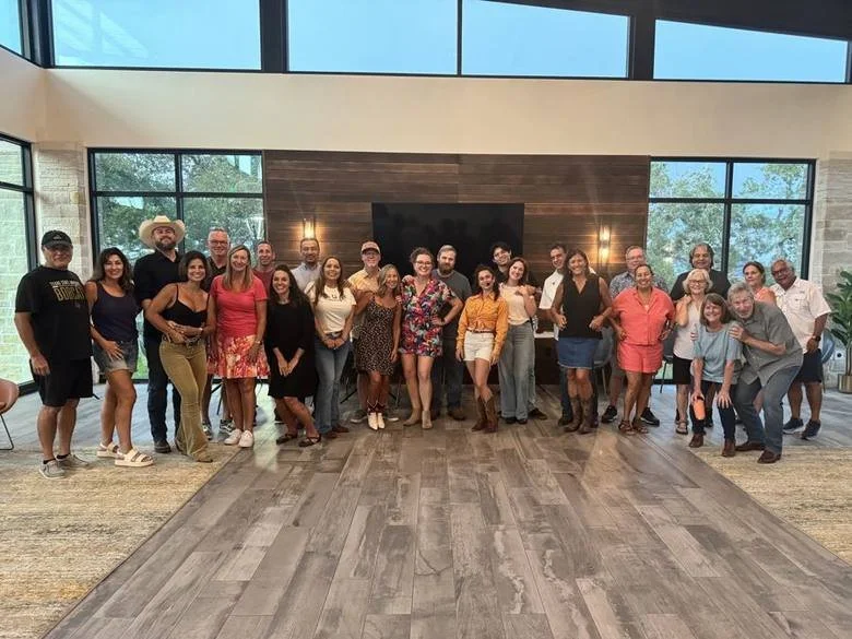 A corporate group at a daytime line dance event in the Texas Hill Country