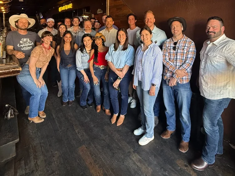 Company team learning to line dance at a Texas corporate event