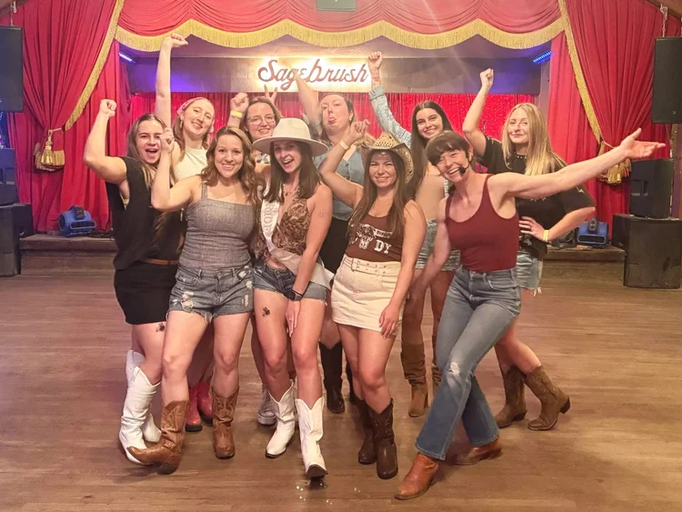 A bachelorette party posing after a line dance lesson in Austin