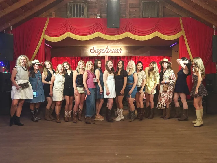 A big bachelorette group at a Double or Nothing line dance lesson in Austin