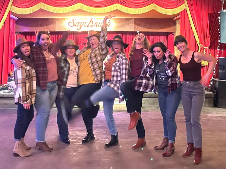 Bachelorette party kicking in a line on the Sagebrush stage in Austin