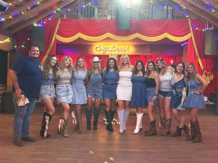 A bachelorette party learning to line dance with Double or Nothing in Austin