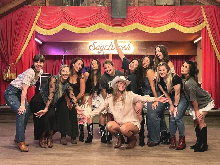 A big bachelorette group at a Double or Nothing line dance lesson in Austin